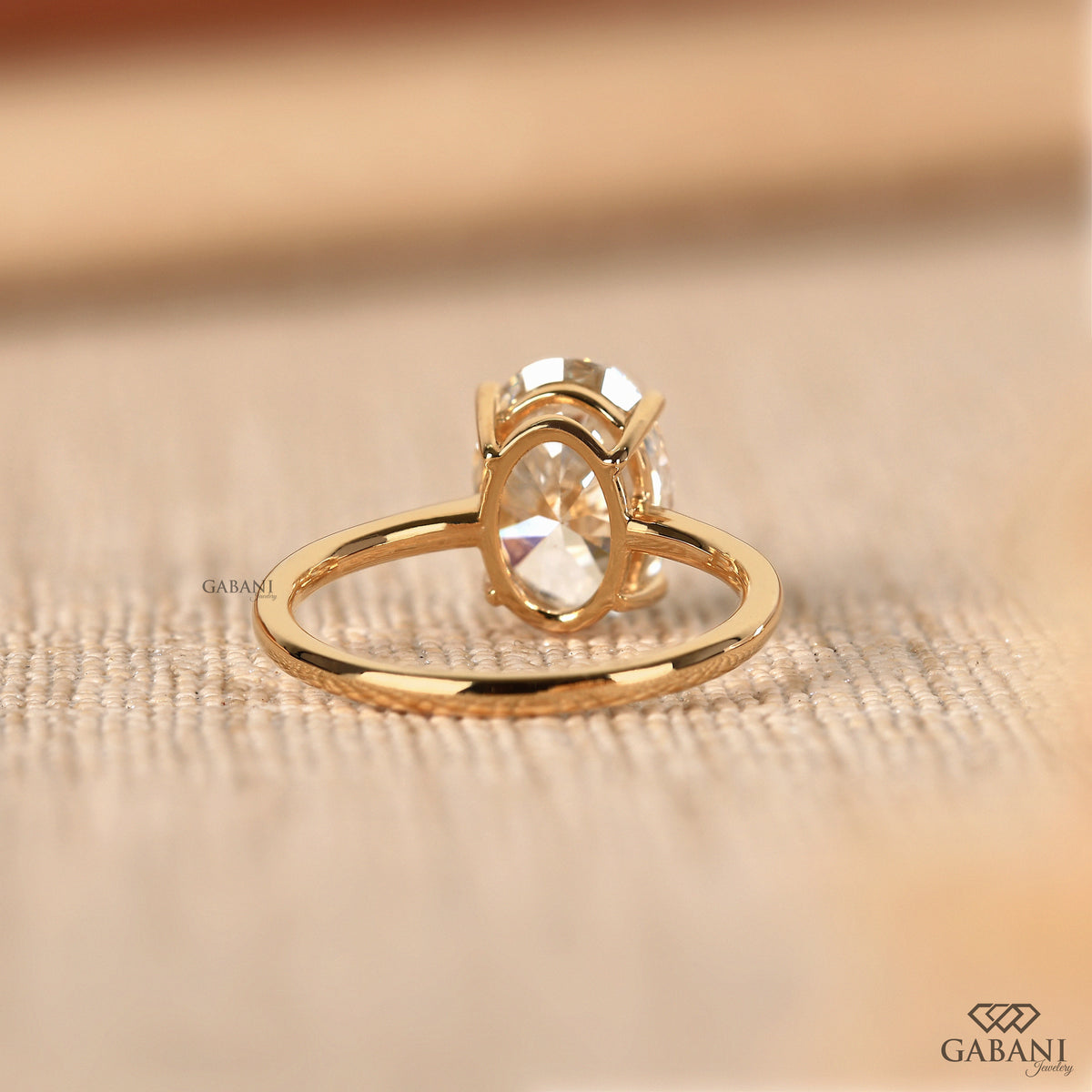 oval lab grown diamond solitaire ring in solid yellow gold with minimalist style
