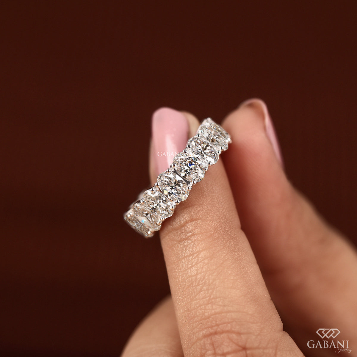 chunky oval cut lab grown diamond band in white gold eternity style ring