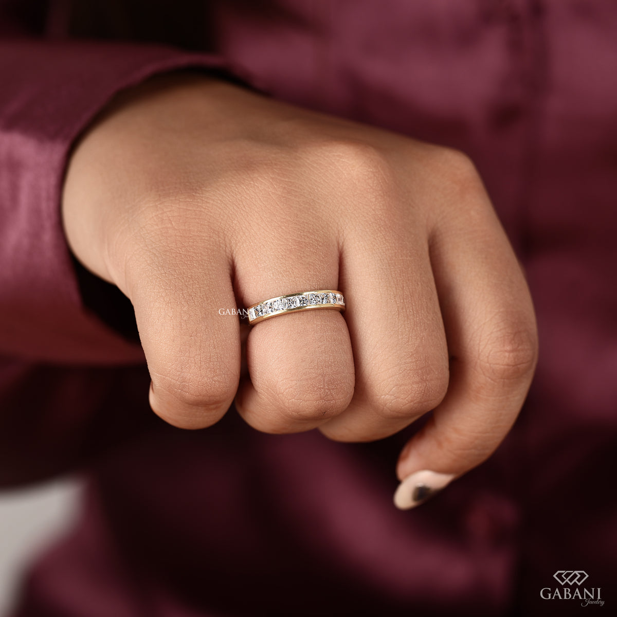 Half eternity wedding band featuring princess cut lab grown diamonds in yellow gold