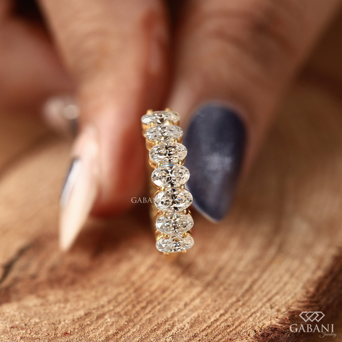 yellow gold seven stone diamond band with oval lab grown diamonds and comfort fit