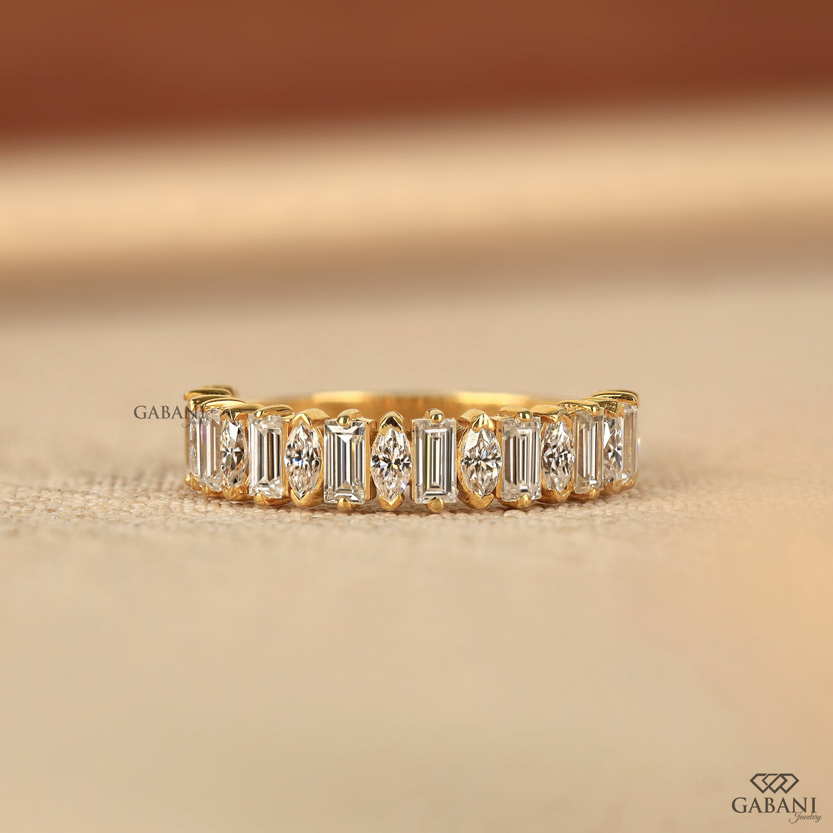Handmade baguette and marquise lab diamond half eternity ring by Gabani Jewelry