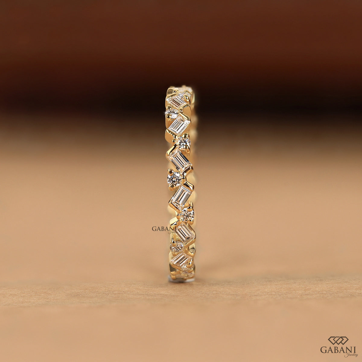 thin gold diamond band with baguette and round lab grown stones zig zag style