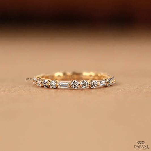 lab grown diamond eternity band with baguette and round stones in 14k yellow gold thin band