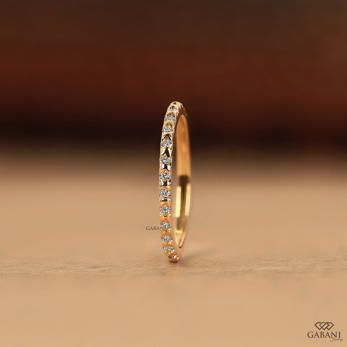 minimal yellow gold wedding band with round lab grown diamonds in slim eternity style
