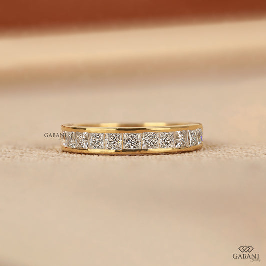 Channel set half eternity band with princess cut lab grown diamonds in 14K yellow gold