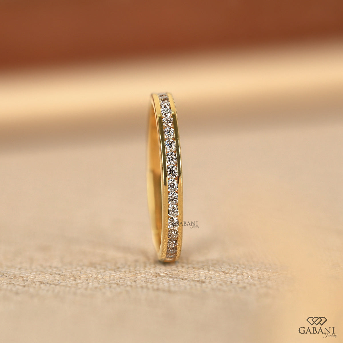 slim low profile yellow gold band with lab grown diamonds