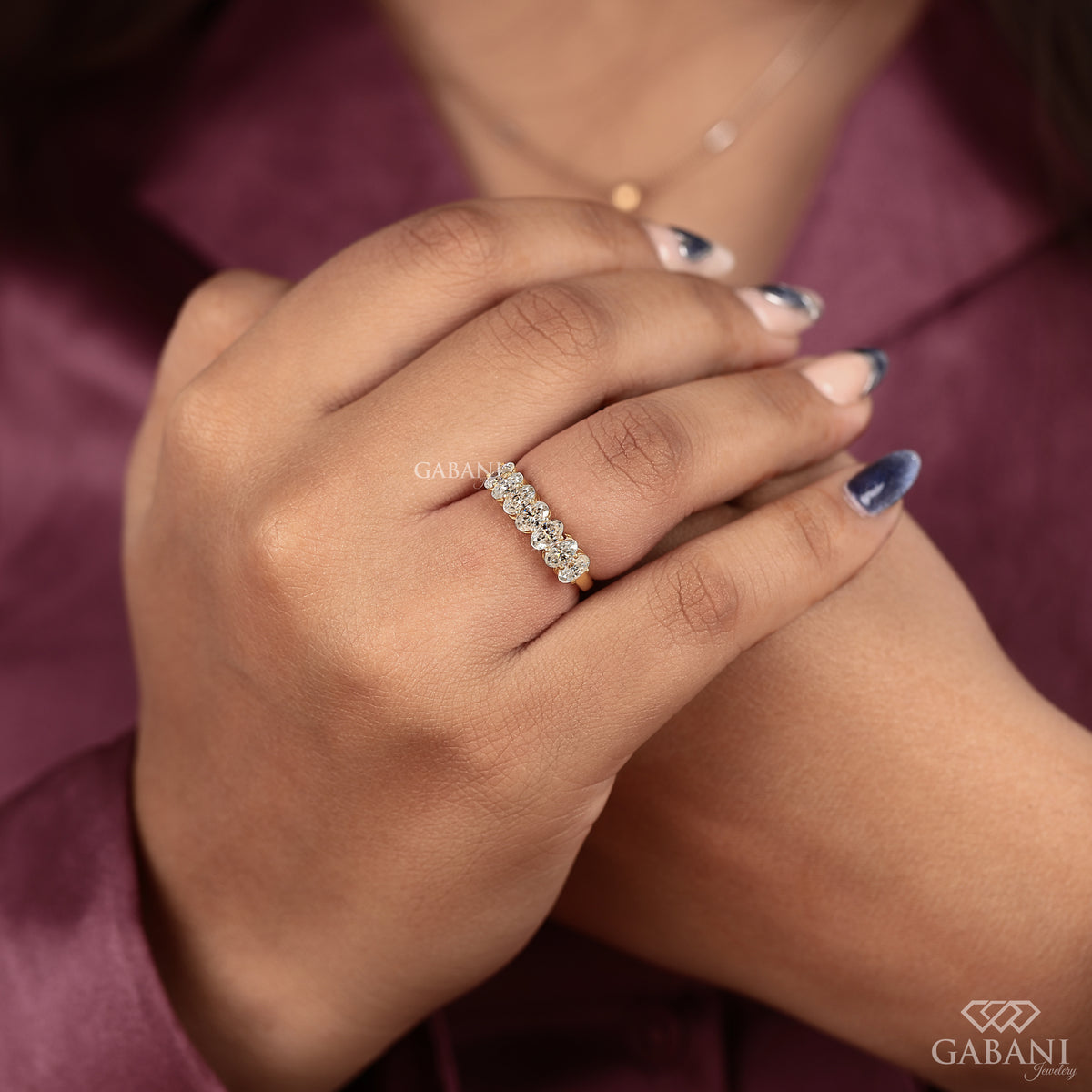 seven stone oval lab created diamond band in yellow gold with comfort fit half eternity style