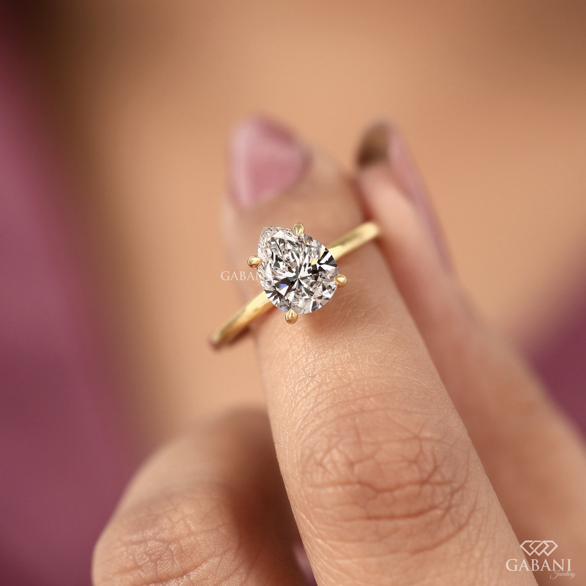 minimal pear shaped lab grown diamond solitaire in yellow gold
