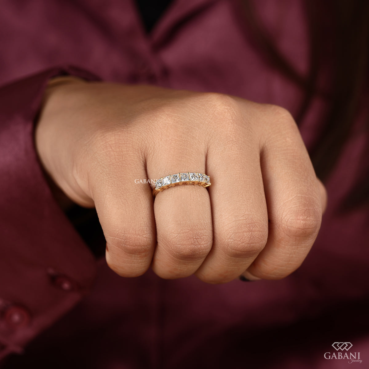 Seven stone lab grown diamond wedding band with princess cut stones
