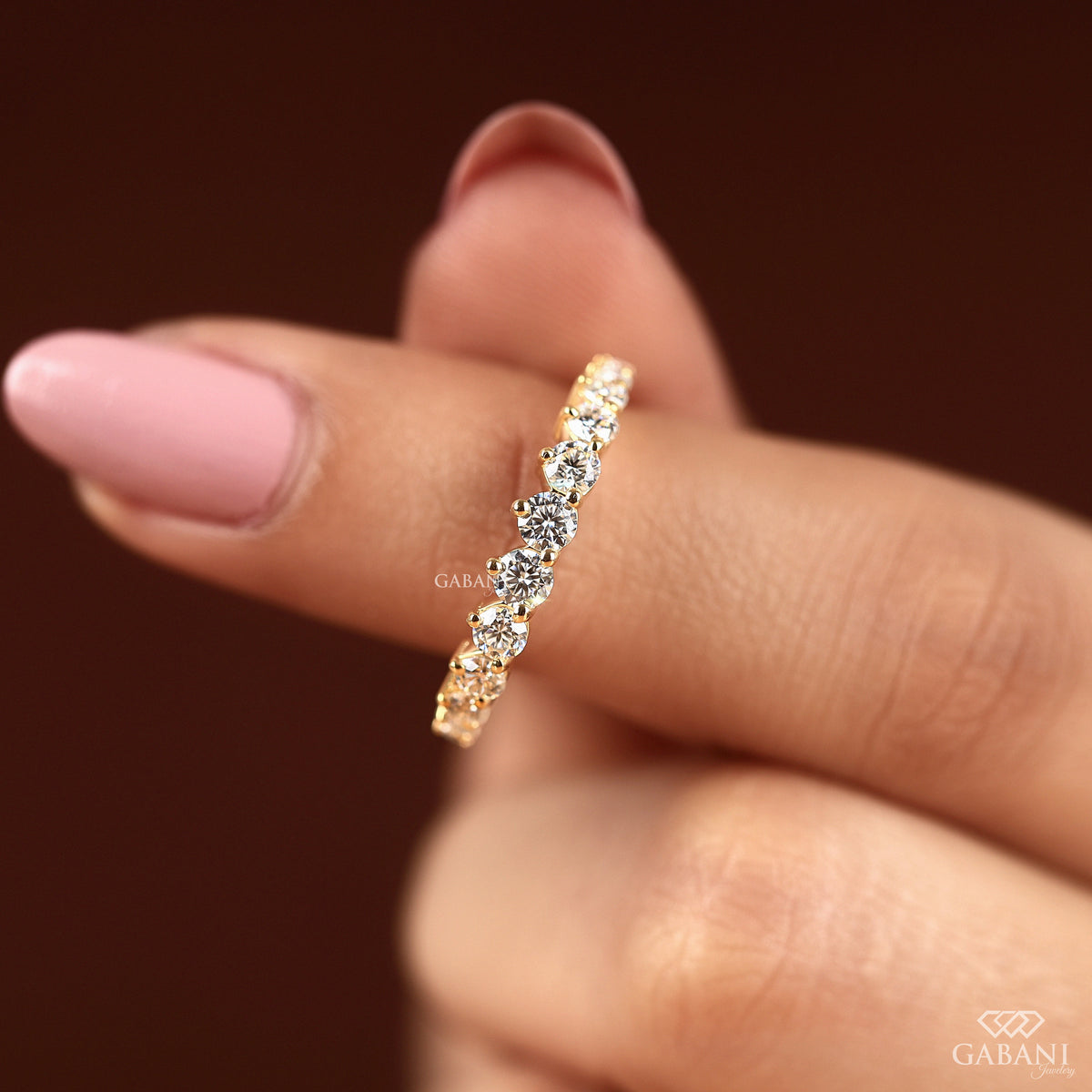 slim yellow gold wedding band with round lab diamond accents
