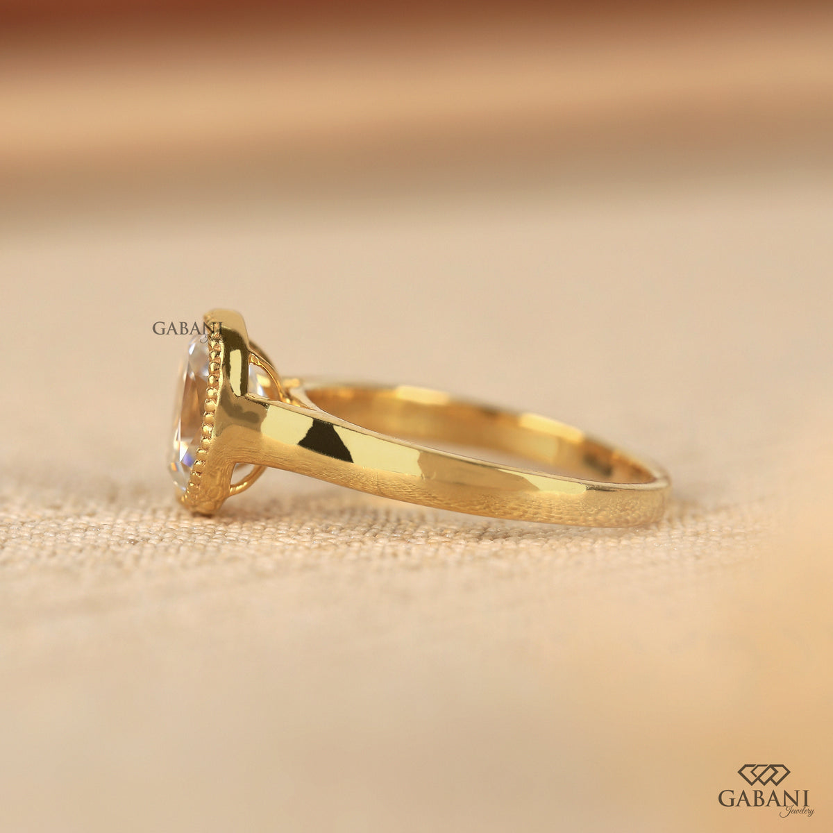 Old mine cut cushion lab grown diamond engagement ring in a classic bezel solitaire style