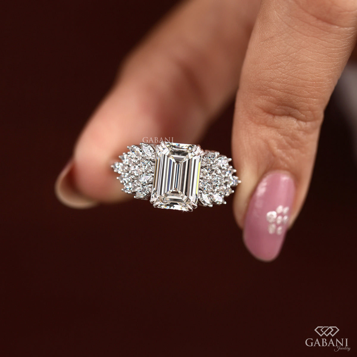 emerald cut lab grown diamond ring with double claw prongs and thick white gold band