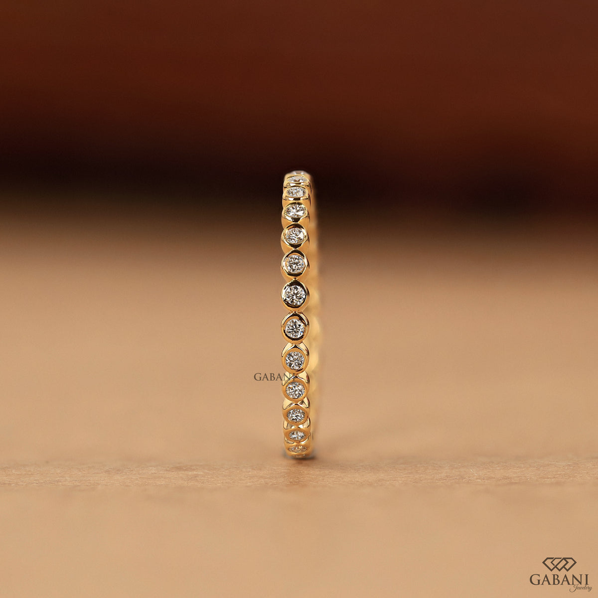 minimal lab grown diamond bezel set wedding band in gold, thin comfort fit eternity band