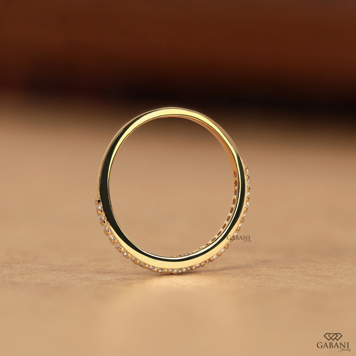 minimal round diamond half eternity band in 14k gold with delicate pave setting