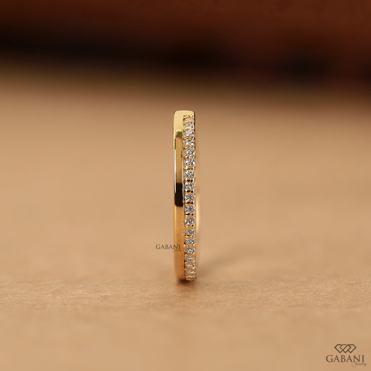 flat gold band with pave set lab grown diamonds half eternity style