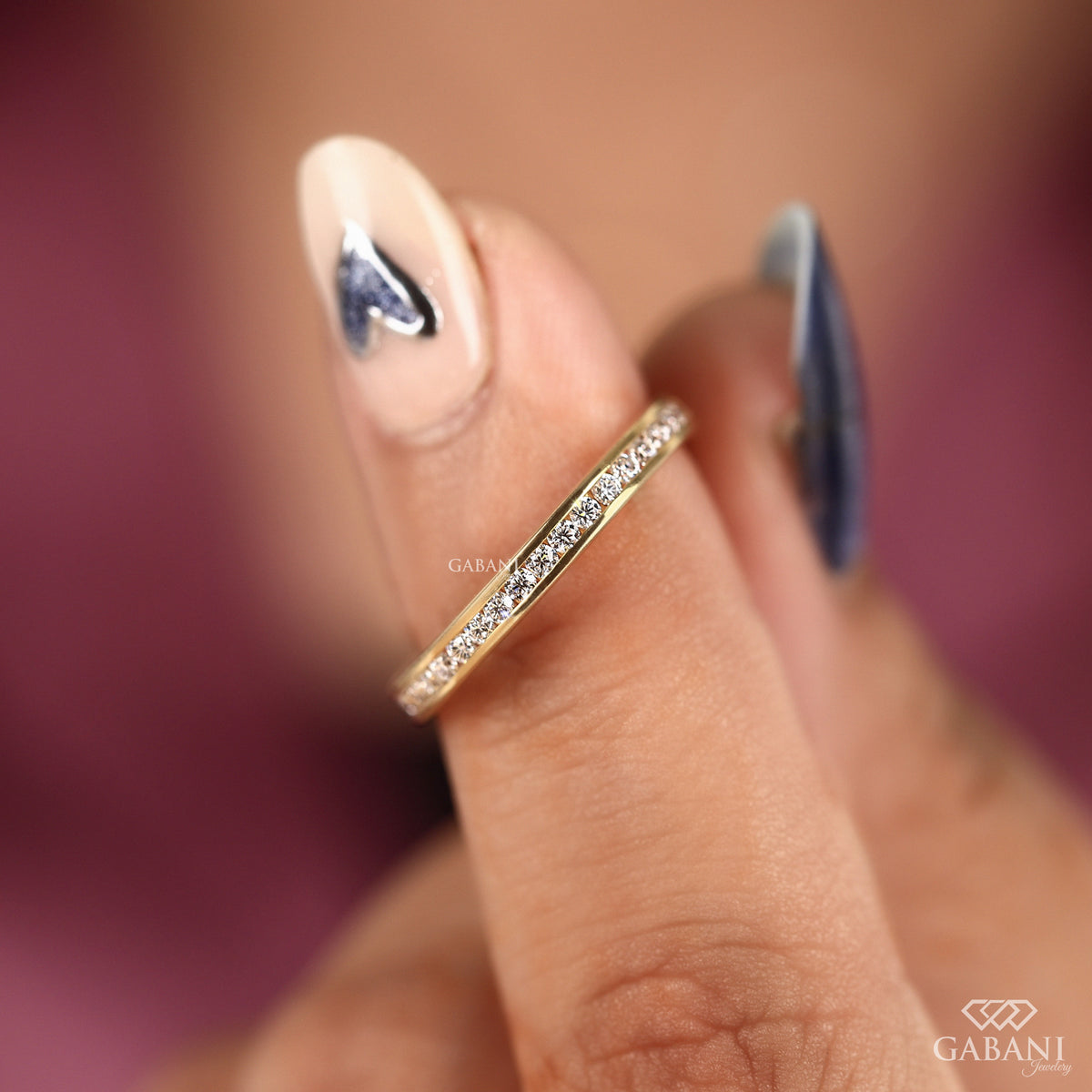 thin channel set lab grown diamond band in polished yellow gold
