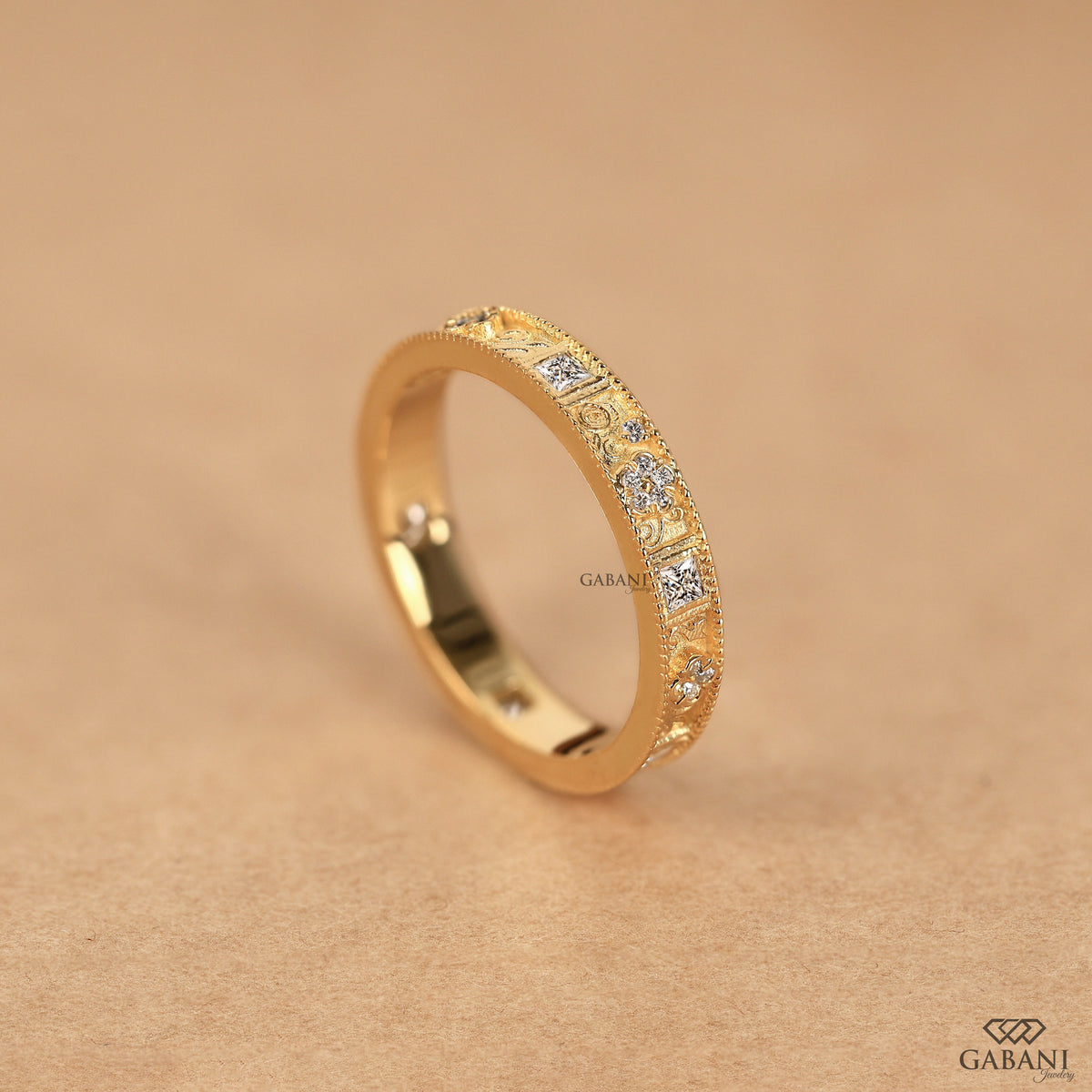 vintage milgrain wedding band with floral engraving and mixed cut lab grown diamonds in 14k yellow gold