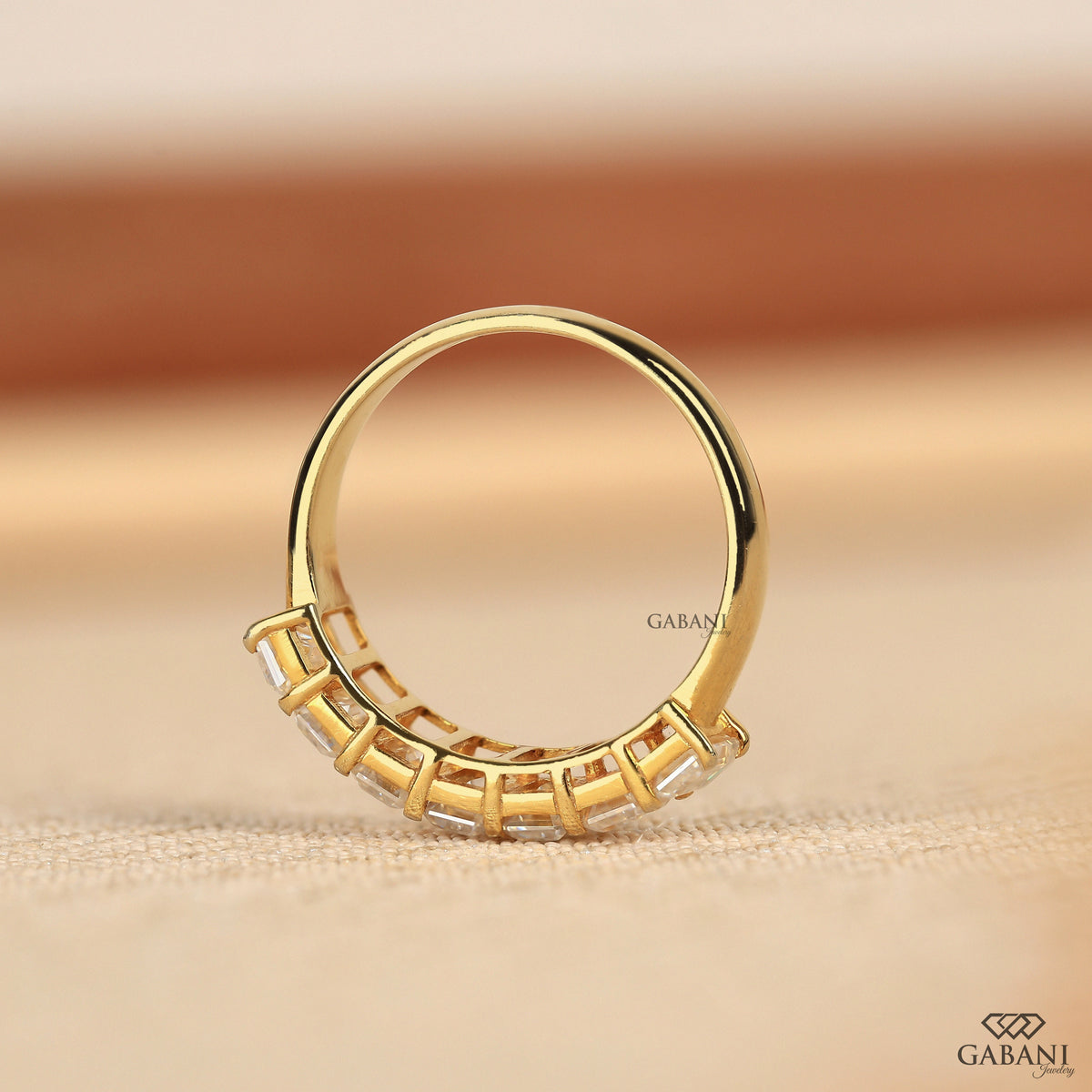 Chunky emerald cut lab grown diamond band in yellow gold