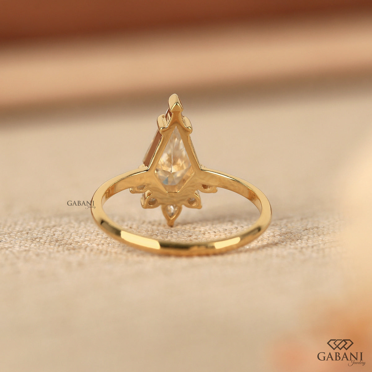 vintage engagement ring showcasing kite cut lab grown diamond in yellow gold