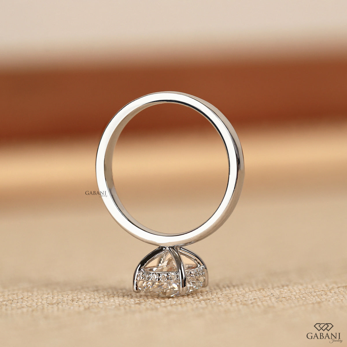 oval lab grown diamond engagement ring with hidden halo basket setting