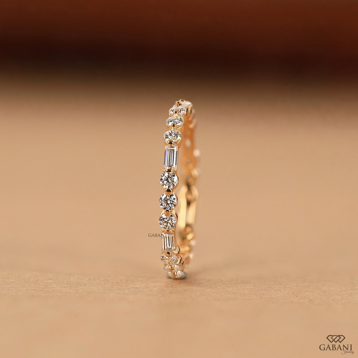 stacking diamond band with lab grown baguette and round stones in 14k gold