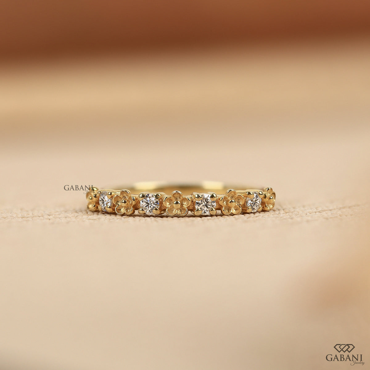 floral lab grown diamond band with a dainty nature inspired design and slim half eternity layout
