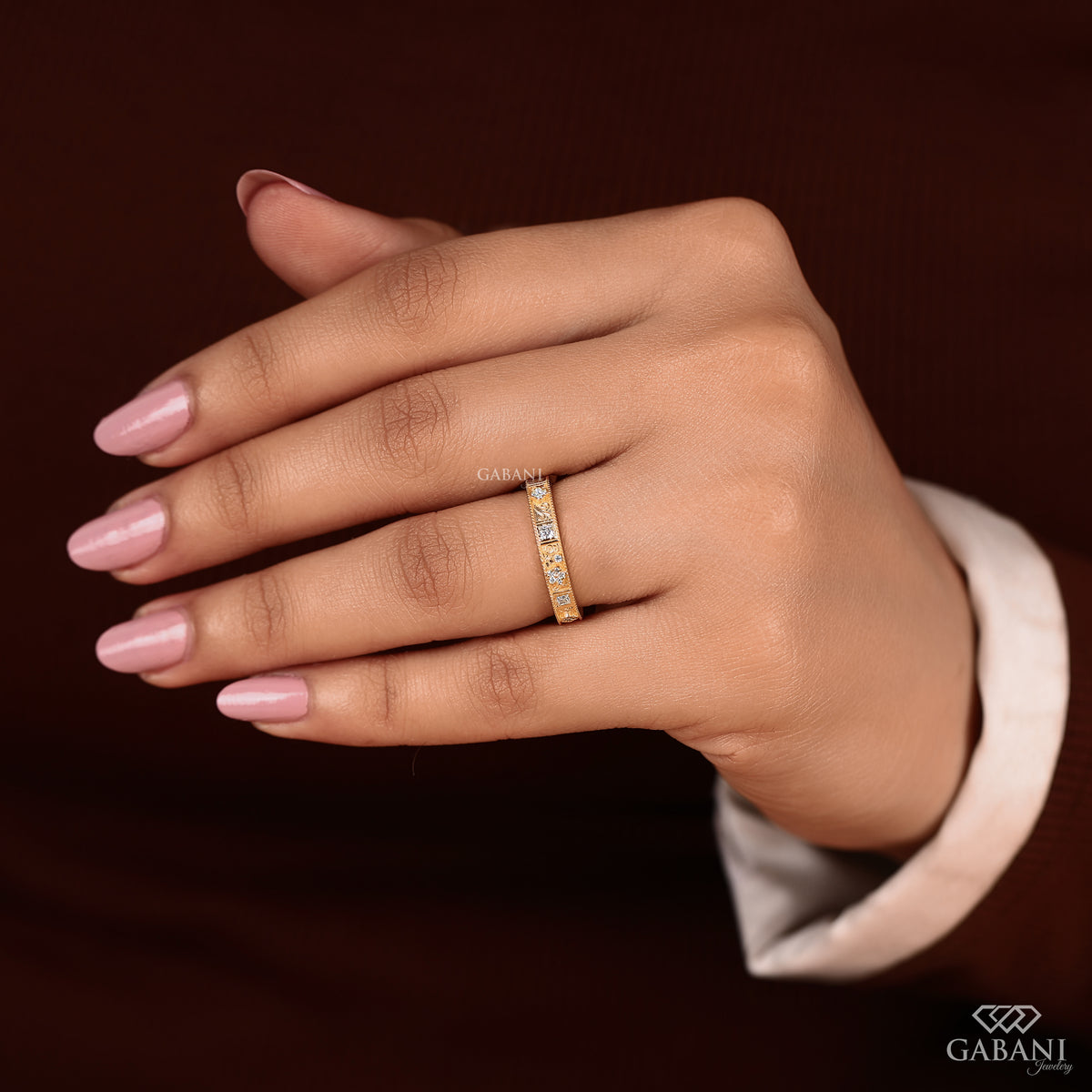 floral engraved milgrain band with lab grown diamonds in princess and round cuts set in 14k yellow gold