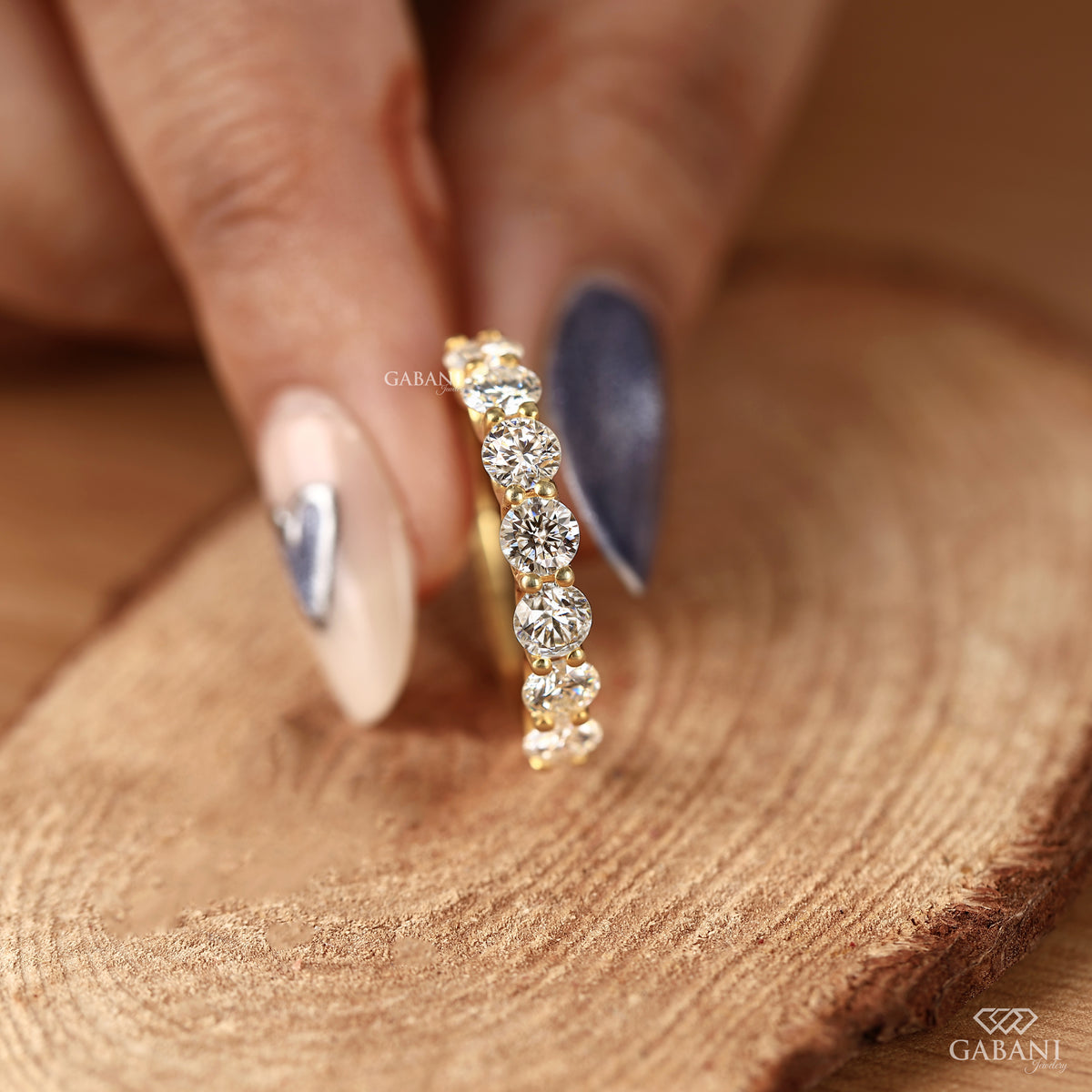 round cut lab grown diamond band designed as a sleek seven stone wedding band in yellow gold