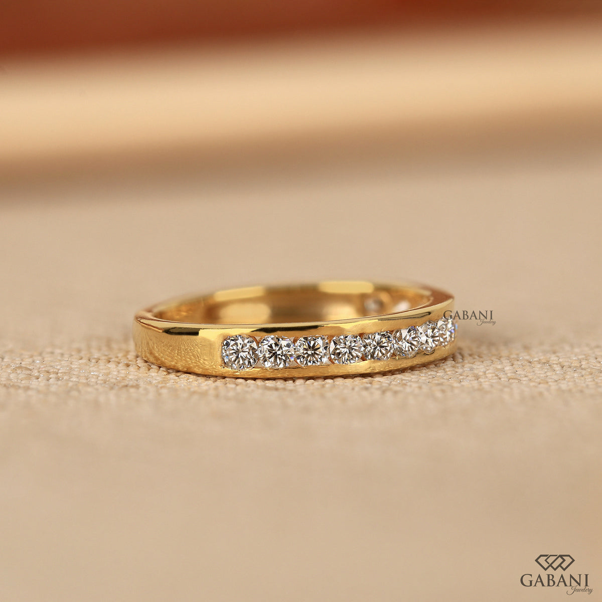 half eternity lab grown diamond band with round stones in yellow gold