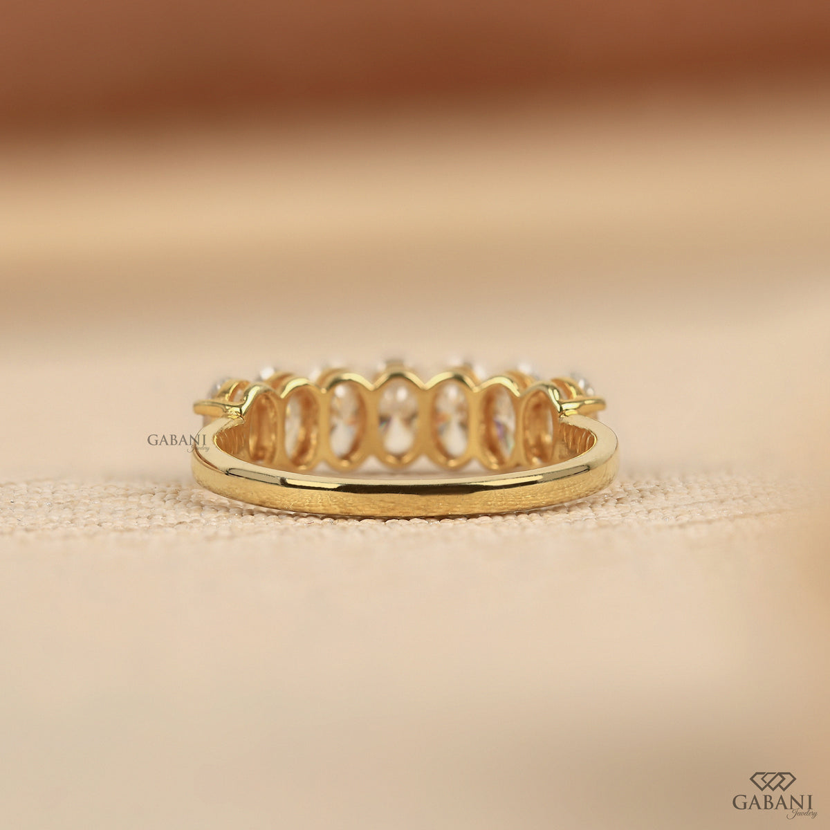 oval cut lab grown diamond band in 14k yellow gold designed for everyday wear