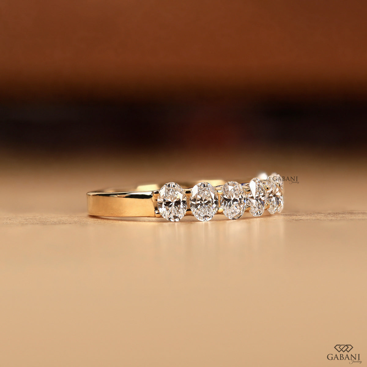 oval cut diamond band with 8 lab stones in u prong design