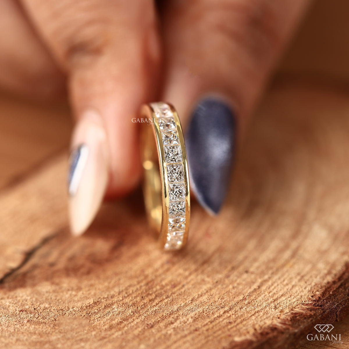 Stackable channel set princess cut lab grown diamond band in yellow gold
