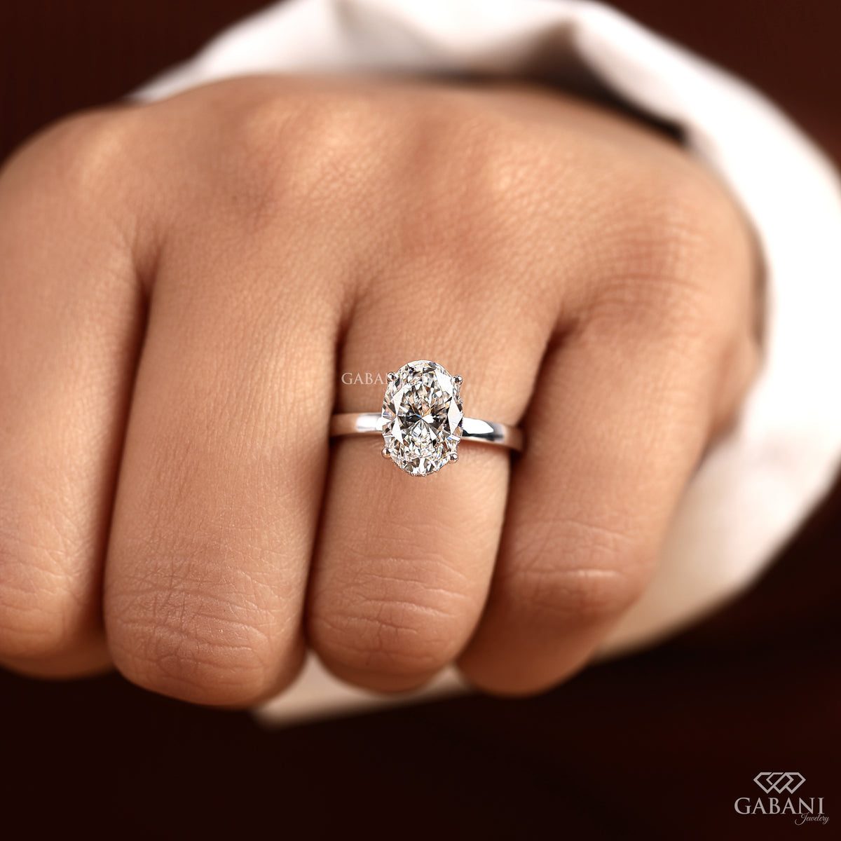 oval cut lab created diamond solitaire ring with flat white gold band