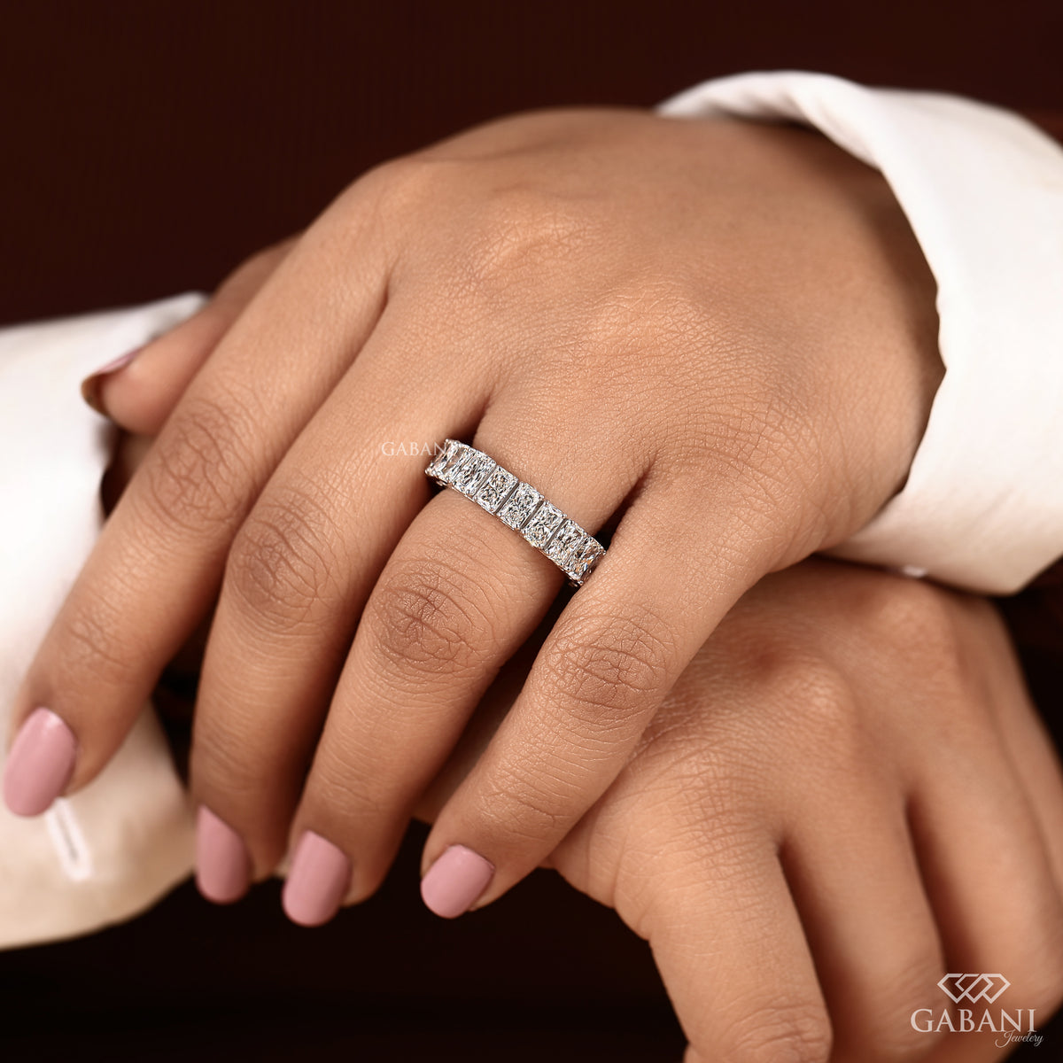 Radiant cut lab grown diamond eternity ring with structured wide band in white gold