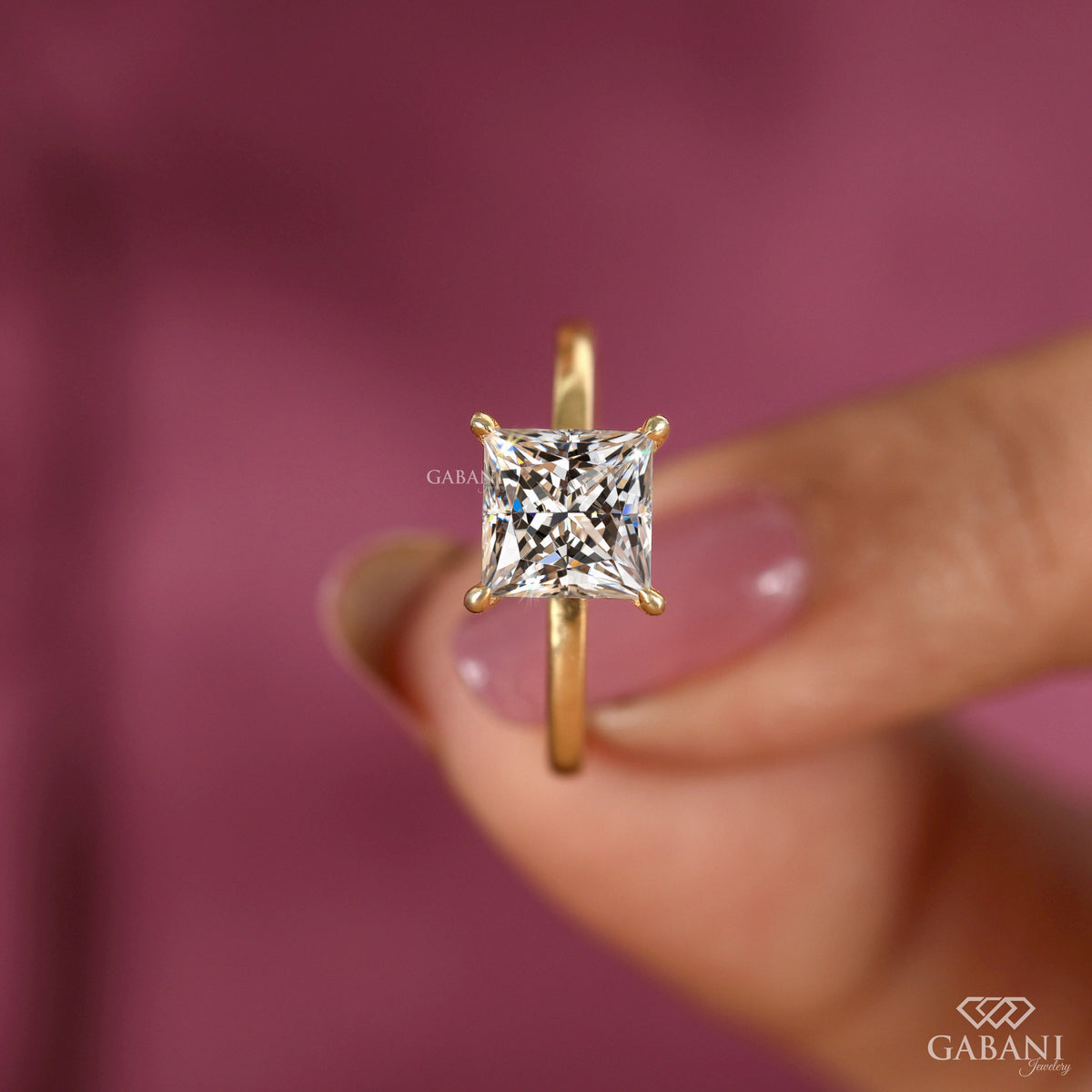 Princess cut lab grown diamond solitaire ring with four claw prong setting