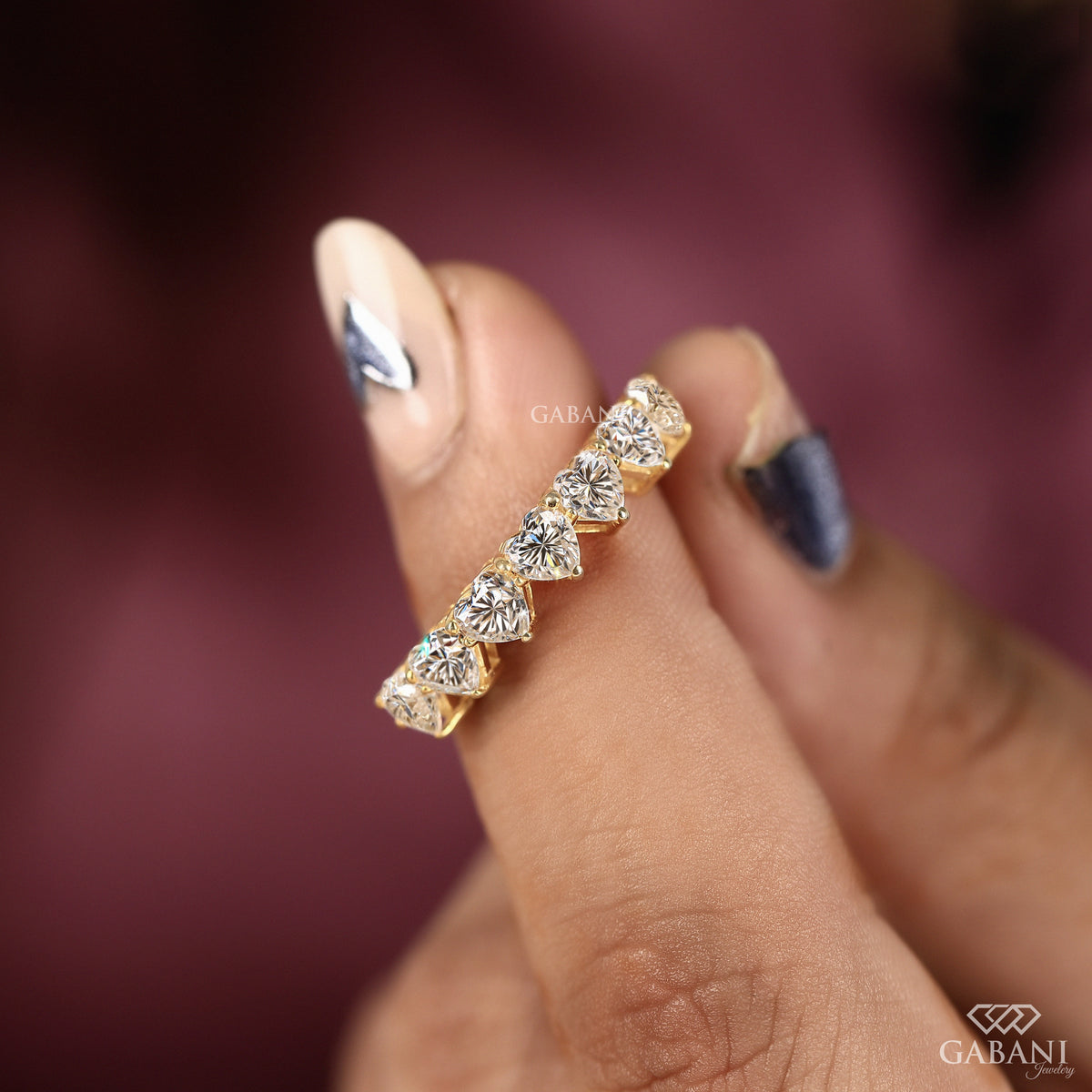 half eternity heart shaped diamond band in yellow gold