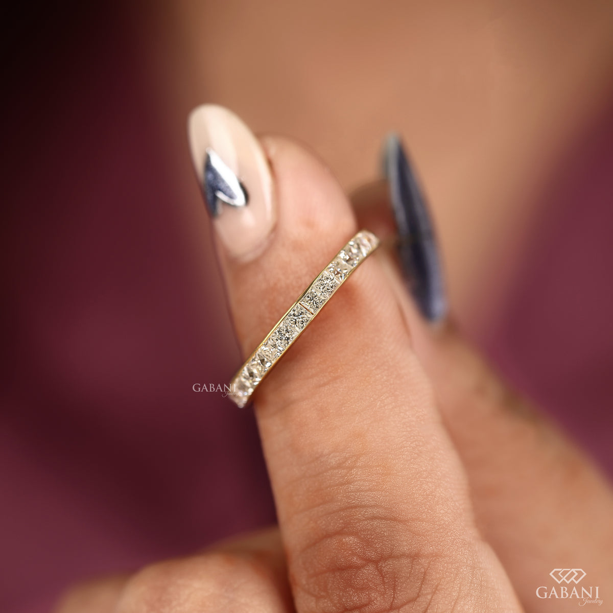 channel set princess cut lab grown diamond band crafted in yellow gold with smooth low profile