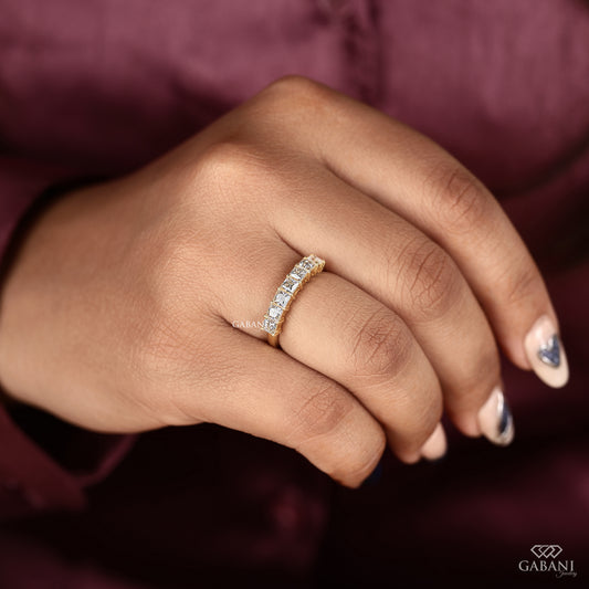 Princess cut lab grown diamond band with seven stones in smooth yellow gold
