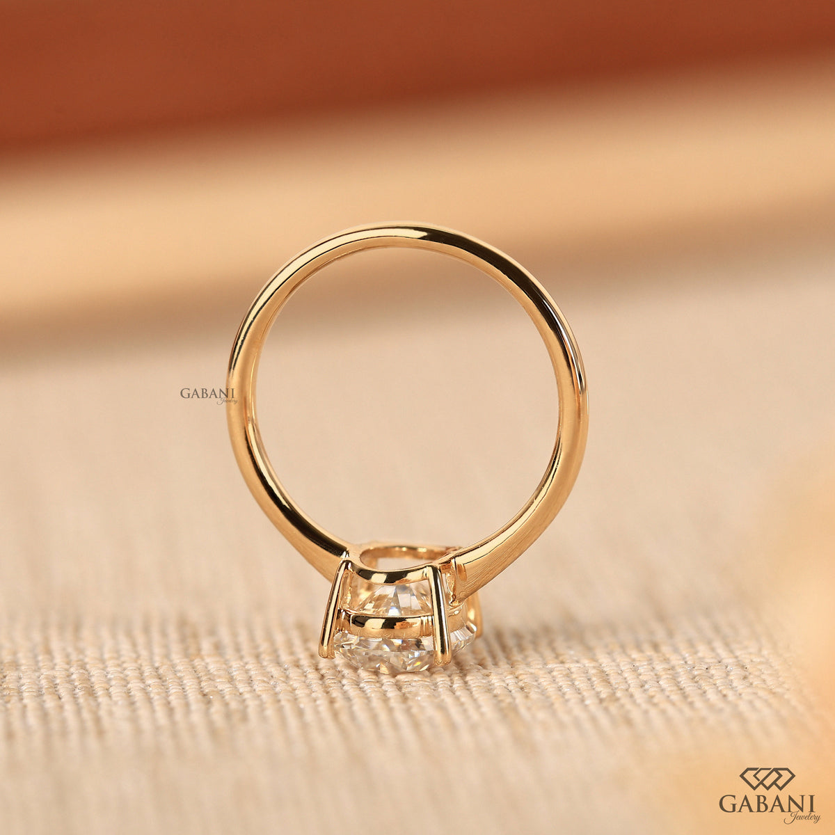 oval cut lab grown diamond engagement ring with pipe shank in 14k yellow gold
