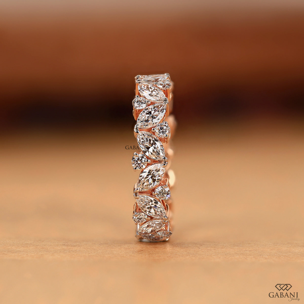 lab grown diamond eternity ring with marquise and round stones in rose gold