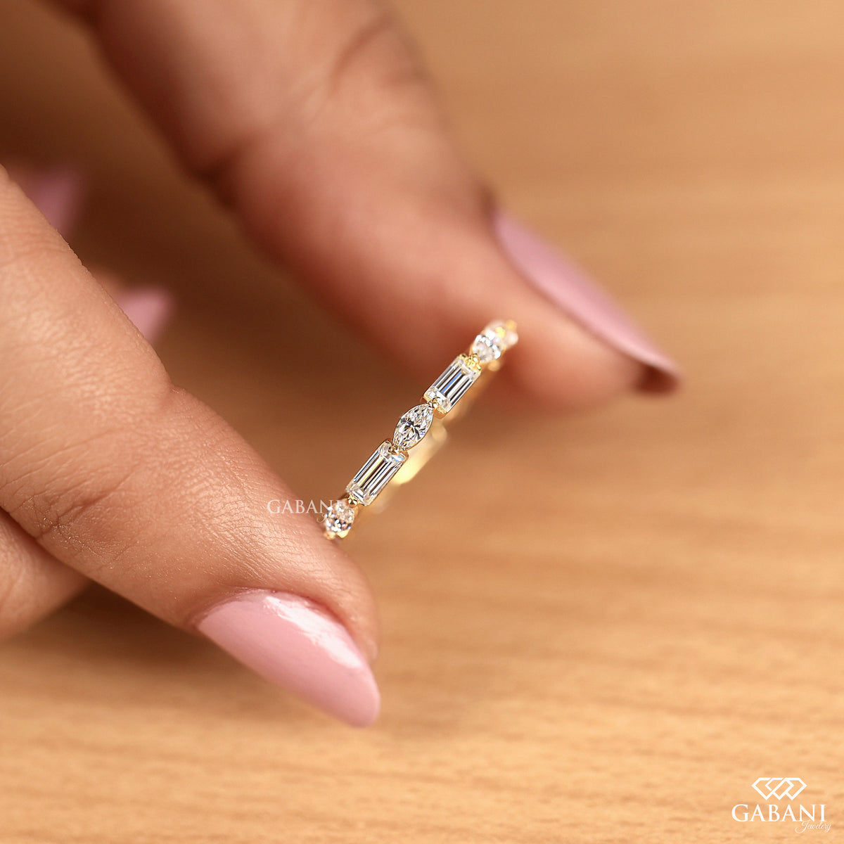 gold eternity band with marquise and baguette lab grown diamonds