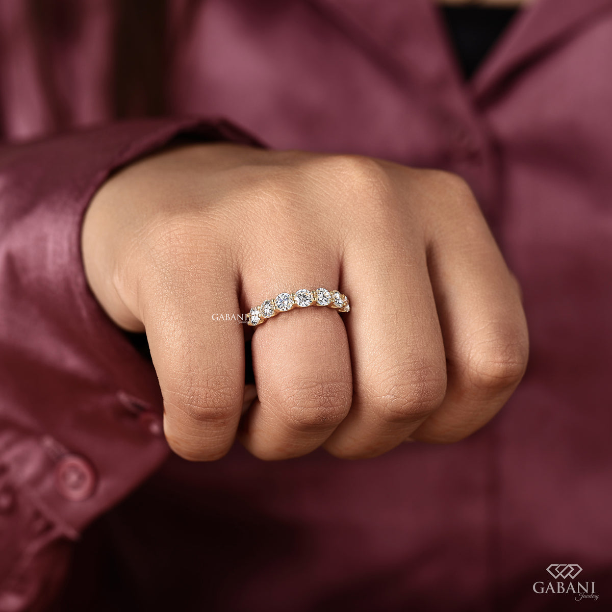 seven stone lab grown diamond band crafted in yellow gold with round cut diamonds and U prong setting
