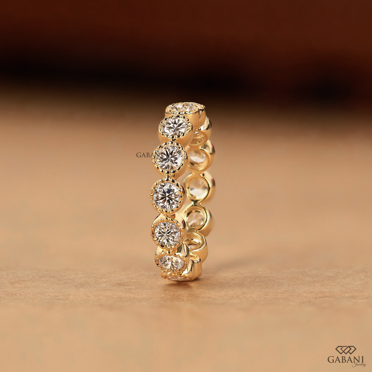 chunky round diamond eternity band in 14k gold with vintage milgrain setting