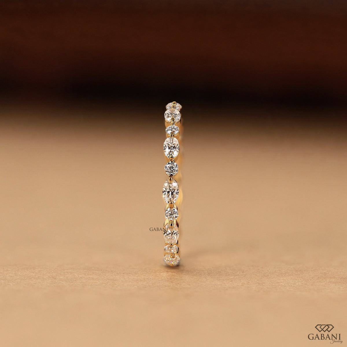 dainty eternity band with oval and round lab diamonds in gold