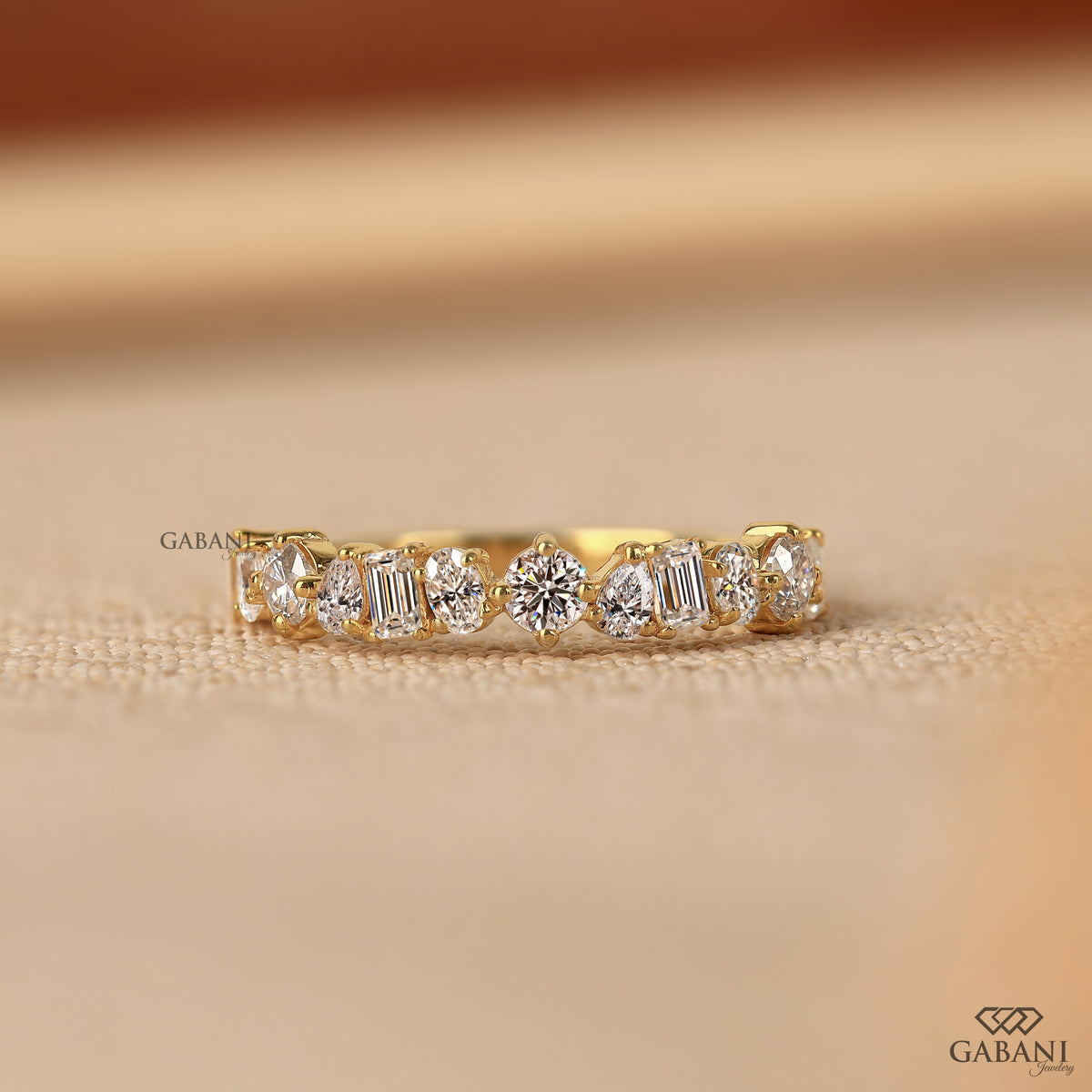 Lab grown diamond wedding band with mixed diamond shapes and sleek pipe shank style
