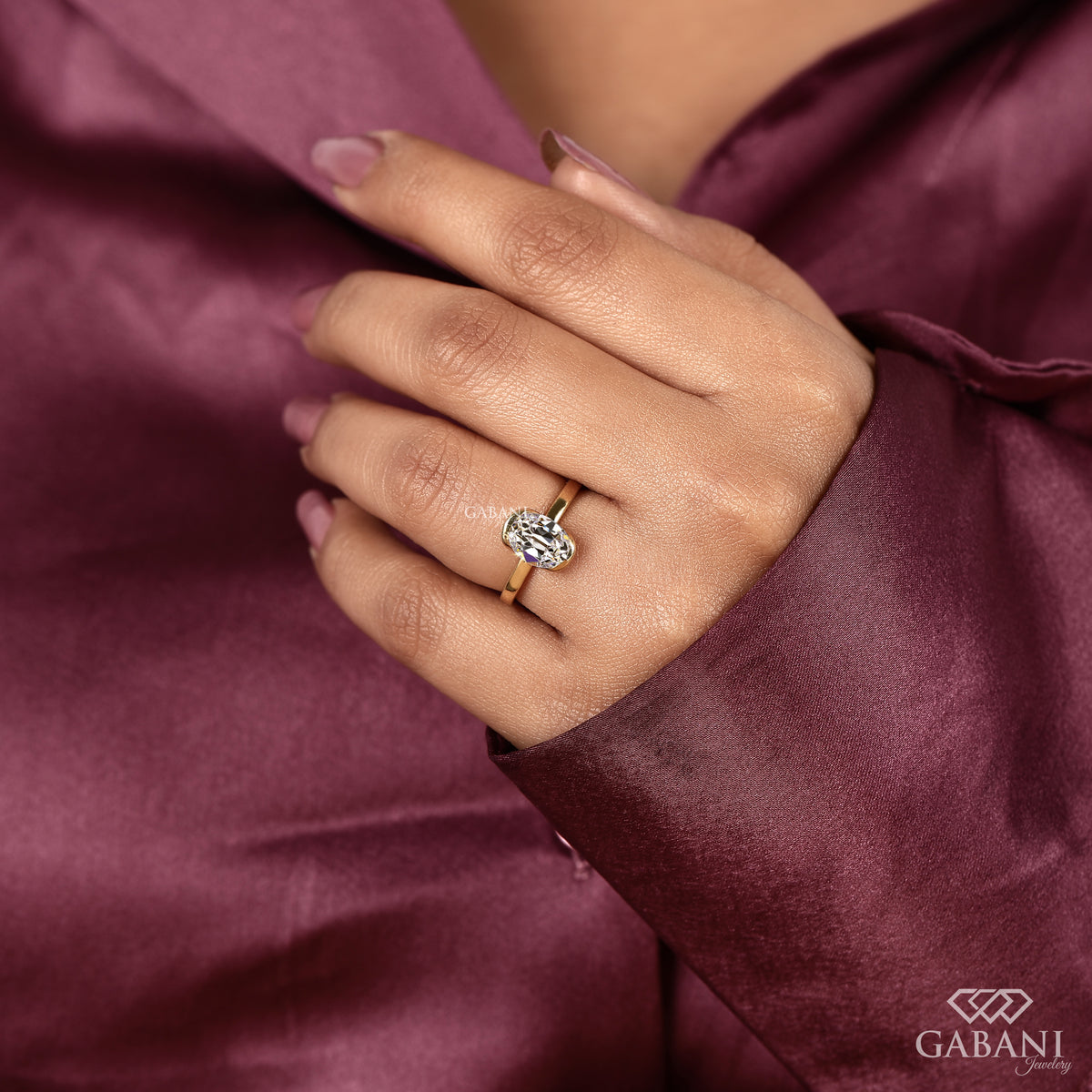Handpicked lab grown diamond solitaire ring with old mine oval cut and half bezel style