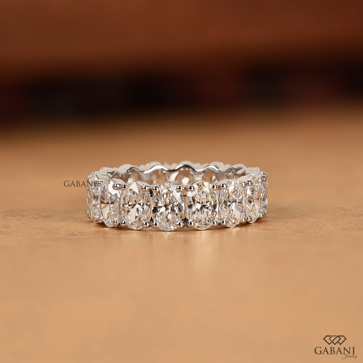 wide white gold oval lab grown diamond eternity wedding band