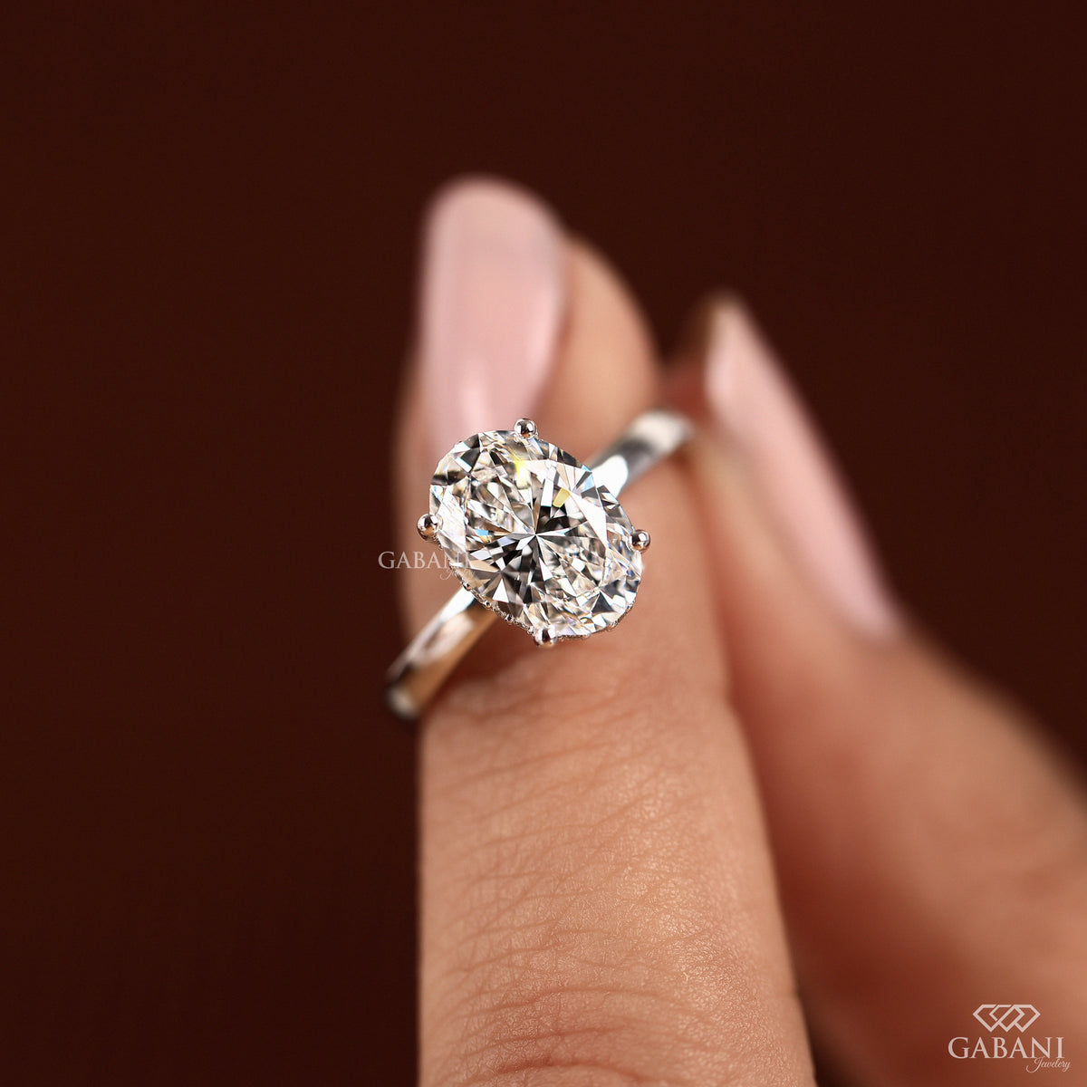 oval cut diamond ring in white gold with subtle hidden halo detail