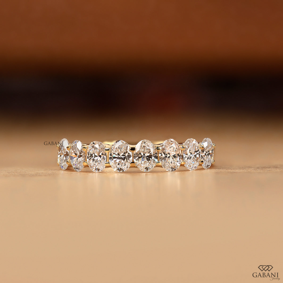 oval lab diamond half eternity band with 8 stones in gold