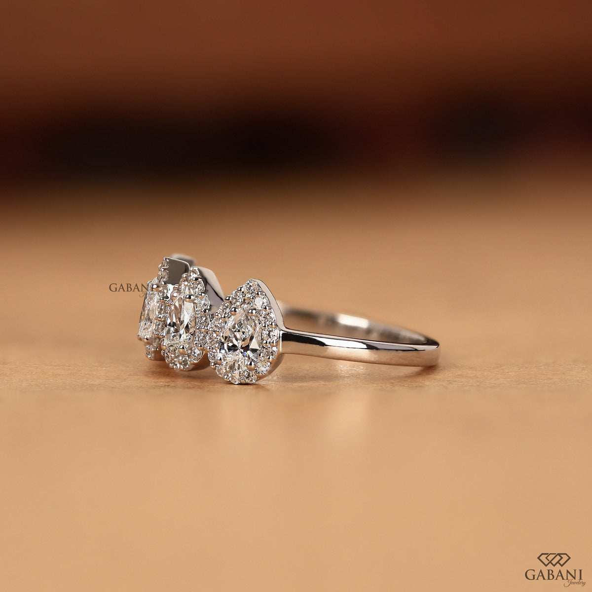 minimal halo pear diamond band in white gold